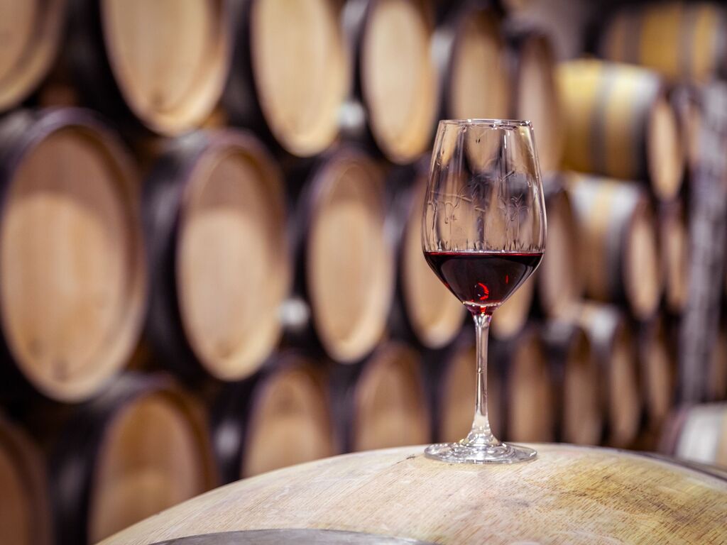 Charlie Palmer glass of red wine before barrel-aging cellar near Appellation Petaluma in Sonoma County wine country
